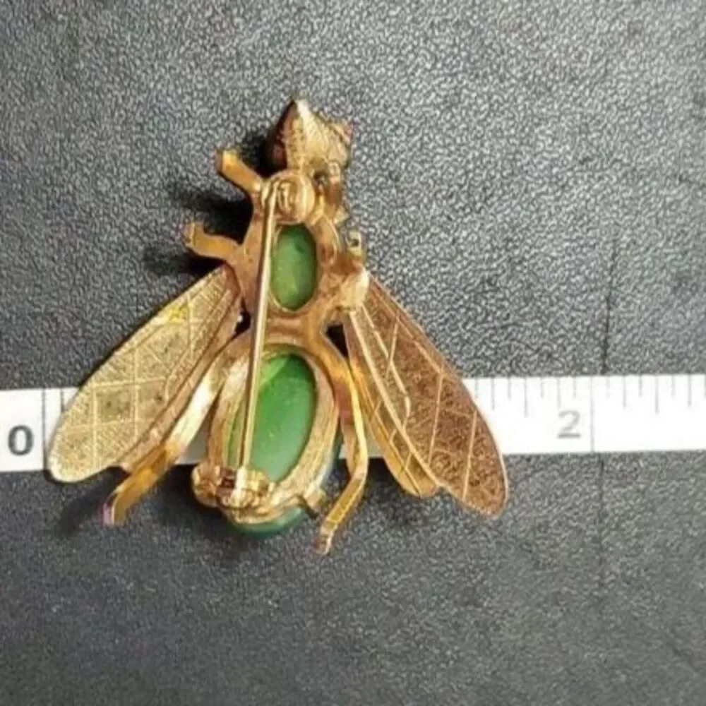 Vintage gold tone fly brooch green